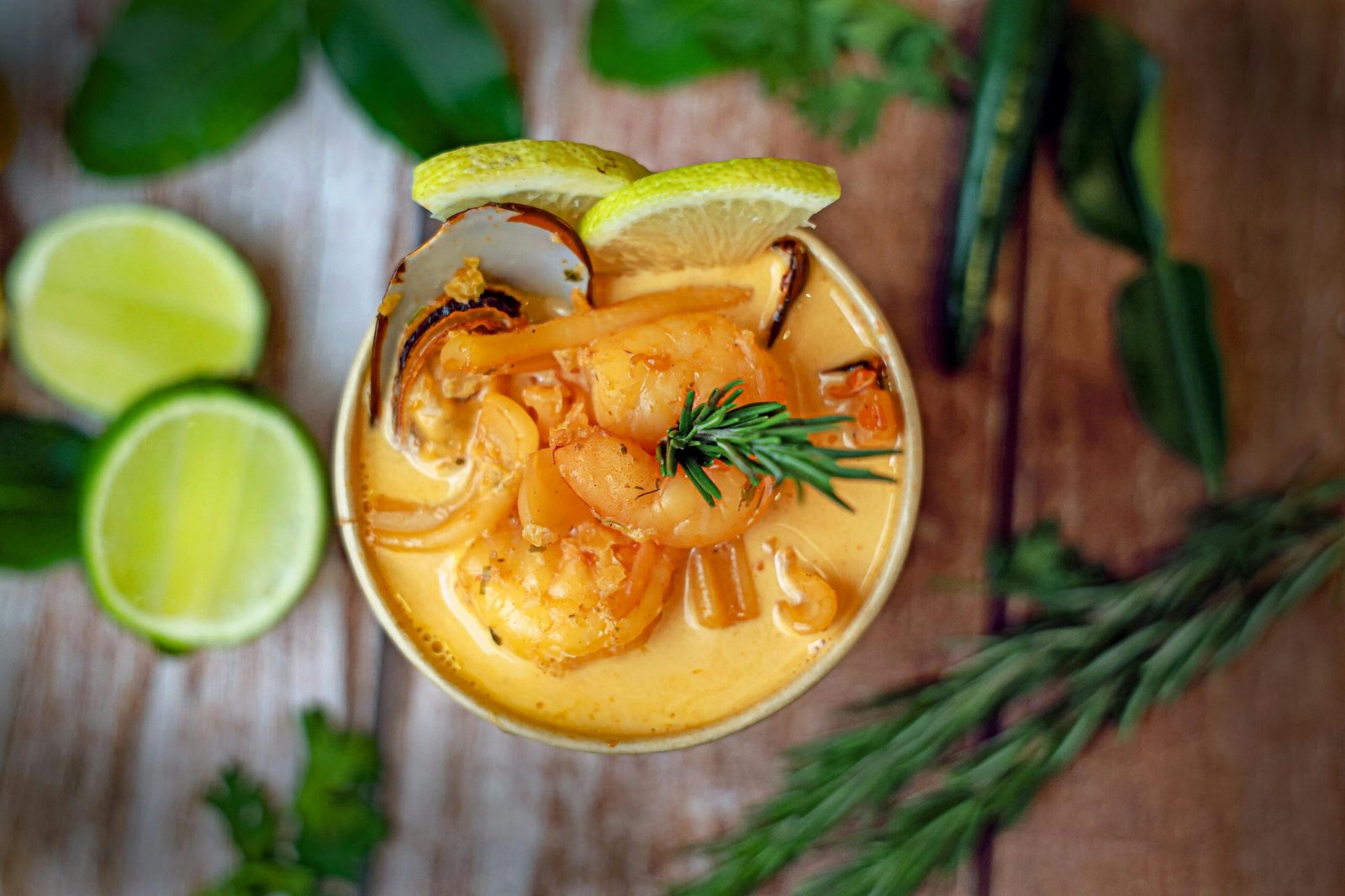 A vibrant seafood curry with shrimp and herbs, perfect for a flavorful dining experience.